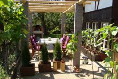Pergola-tessiner-granit-Kastanienrundholz-Top